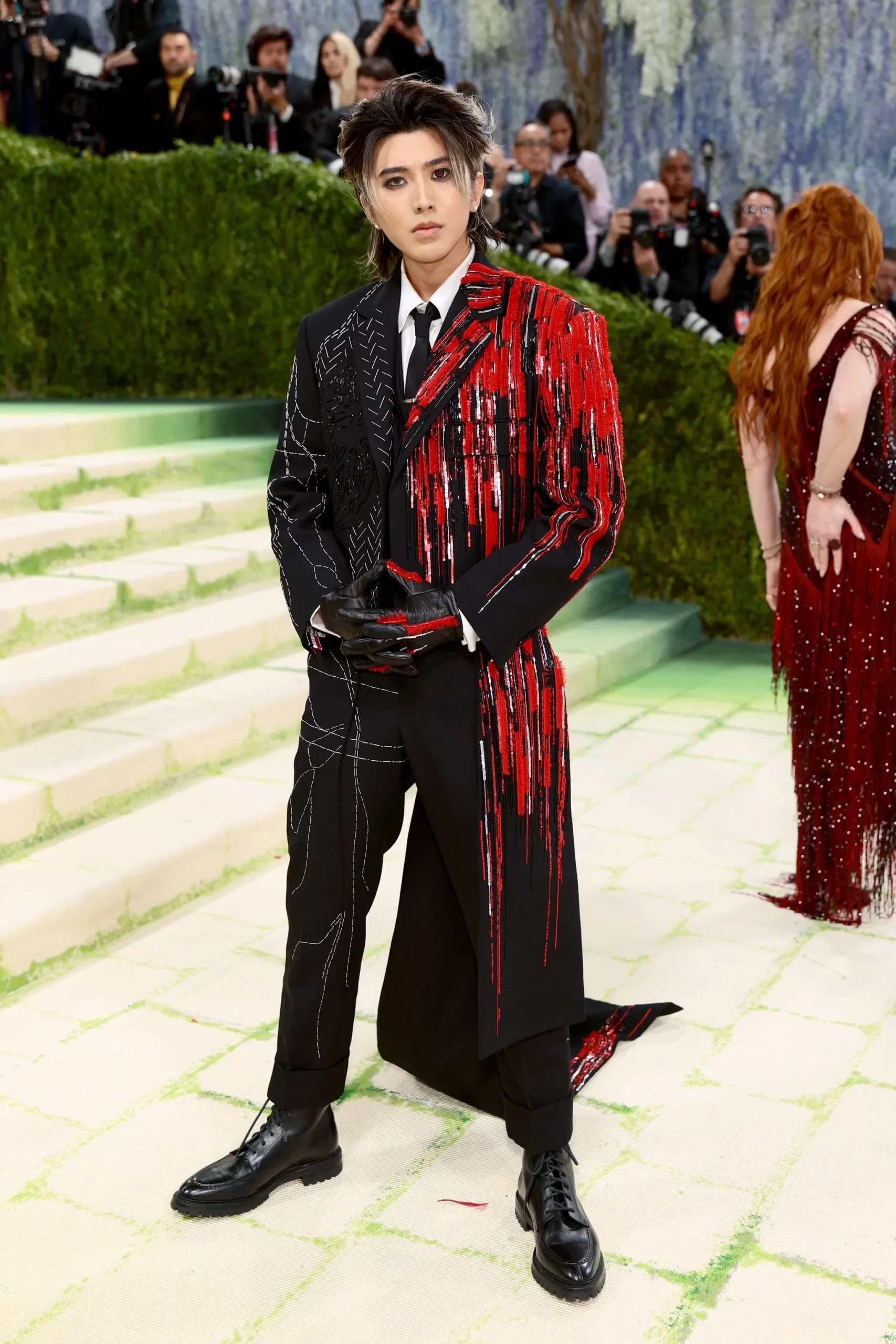 KUN wears a custom suit by Thom Browne, that characterises his Dead Man persona, on the MET GALA red carpet 2026.